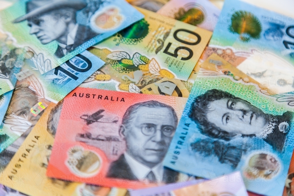 Scattered pile of australian notes in cash five dollars to fifty all new notes - Australian Stock Image