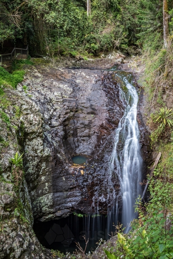 Scenic view of water flowing into underground cave - Australian Stock Image