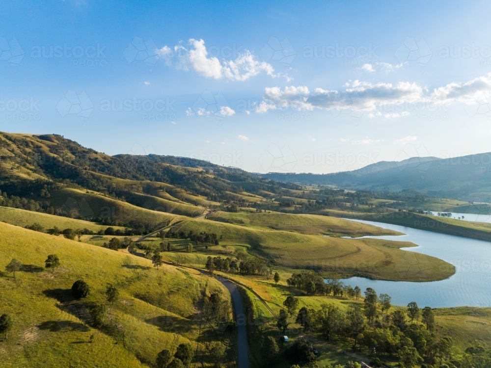Scenic view over country paddocks to Lake St Clair in Hunter Valley - Australian Stock Image