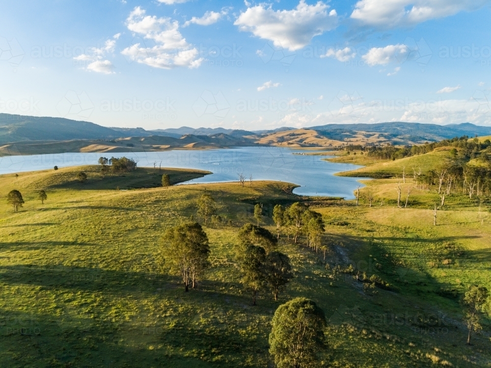 Scenic view over country paddocks to Lake St Clair in Hunter Valley - Australian Stock Image