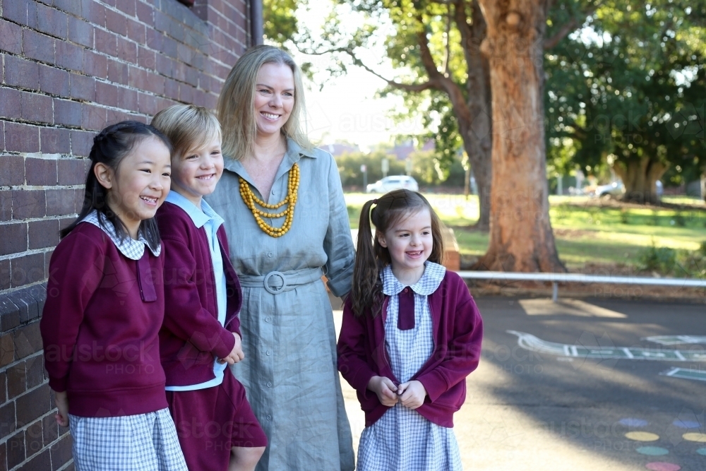 School children standing with their teacher - Australian Stock Image