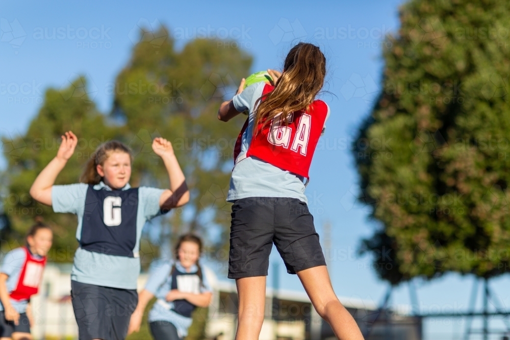 School girls playing netball - Australian Stock Image