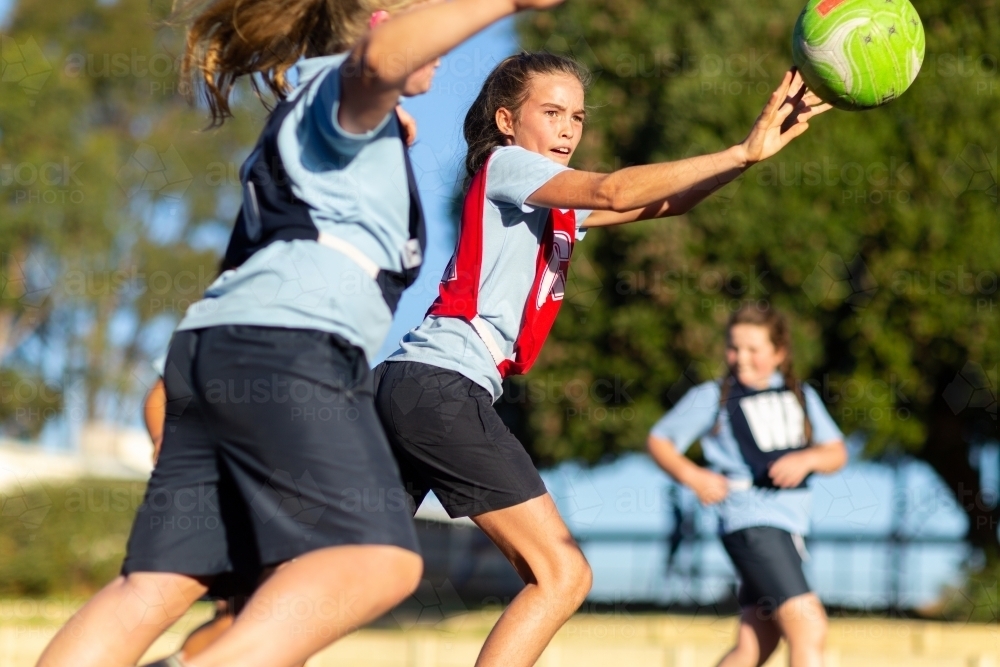 School girls playing netball - Australian Stock Image