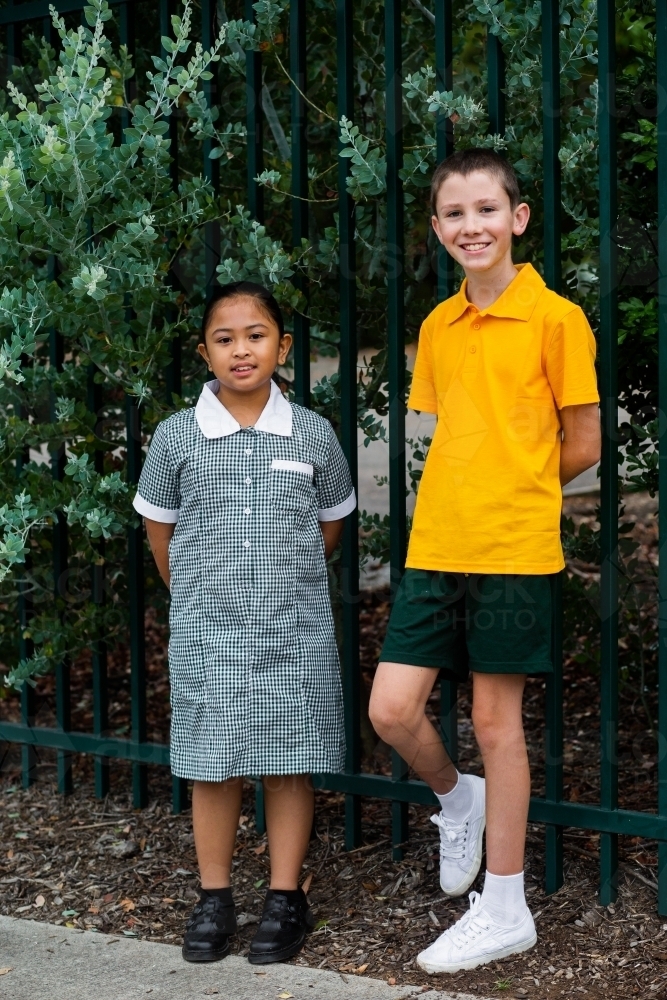 School kids standing by the fence - Australian Stock Image