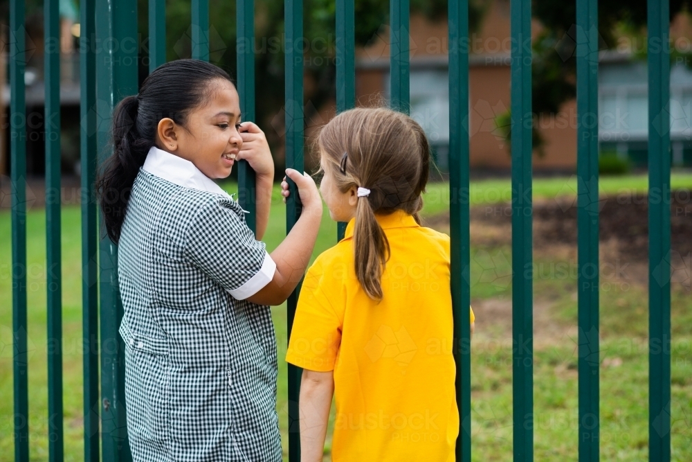 School kids standing by the fence - Australian Stock Image