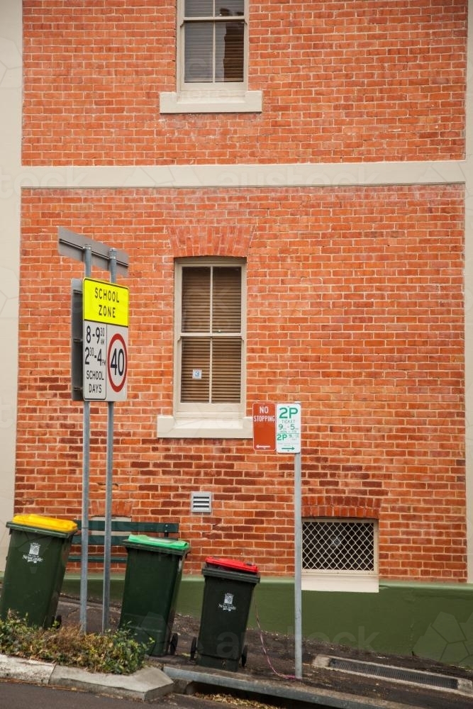 School zone sign and council bins on a steep Newcastle street - Australian Stock Image
