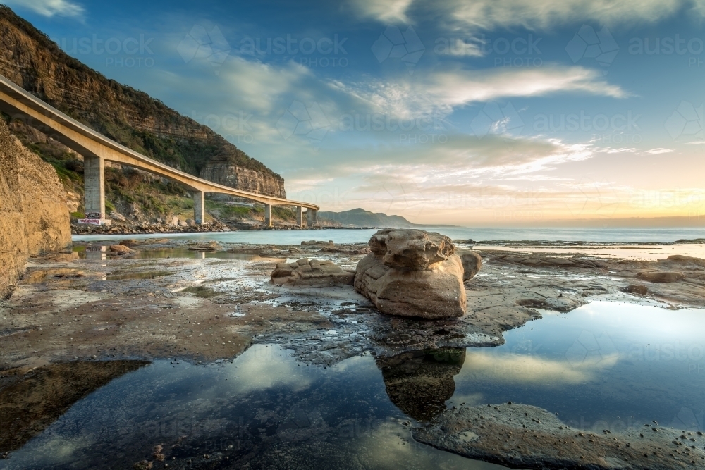 Sea Cliffs Ramp Image of Sea Cliff Bridge from the rockshelf. - Austockphoto