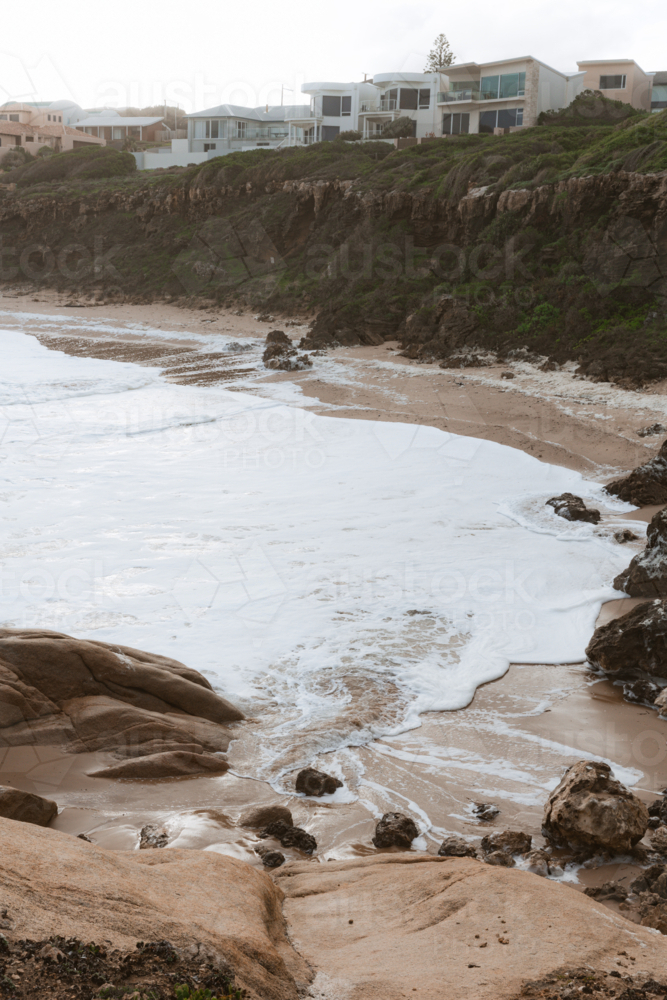 Sea foam from Algae Bloom filling bay at Knights Beach - Australian Stock Image