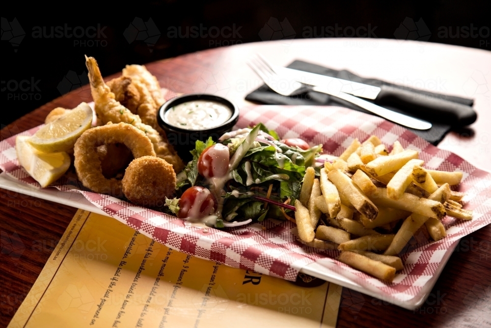 Seafood, salad and chips in a cafe - Australian Stock Image