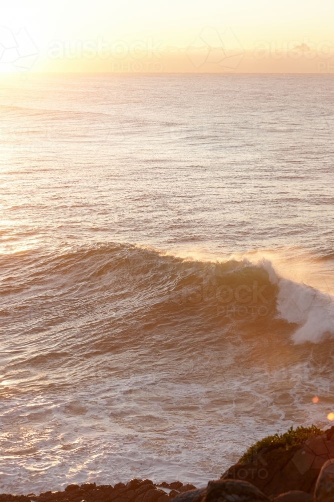 Seascape and large wave at sunrise - Australian Stock Image