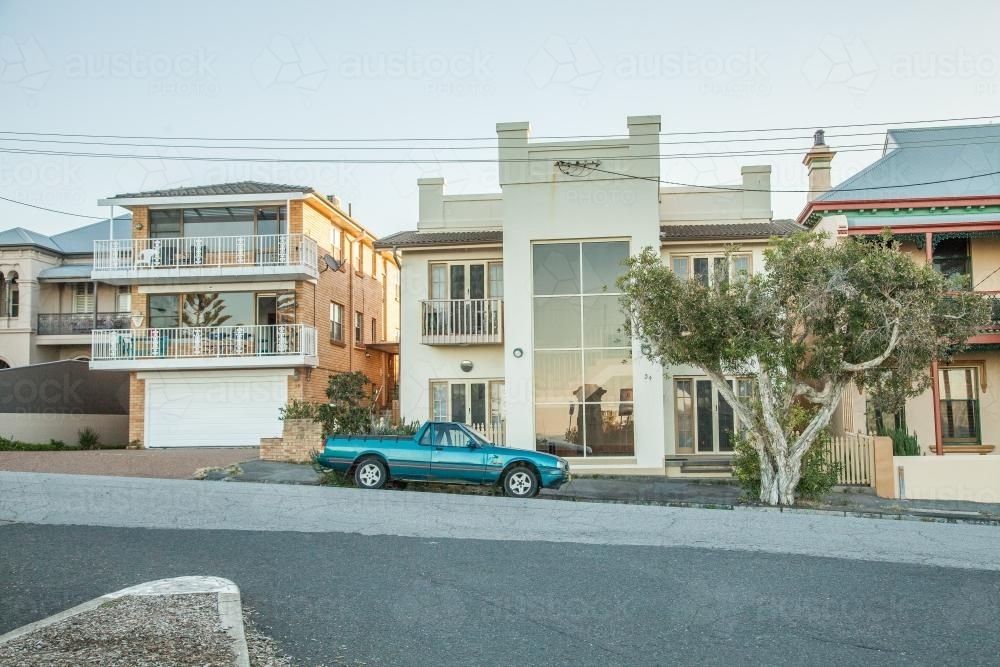Seaside houses with a car parked out the front - Australian Stock Image