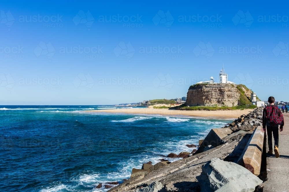 Seaside scene off Newcastle Breakwater on sunny winter day - Australian Stock Image