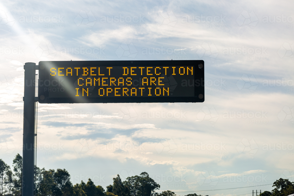 Seatbelt detection cameras are in operation digital sign above highway - Australian Stock Image