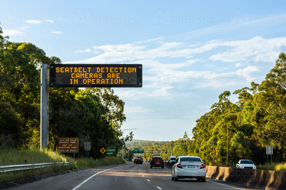 seatbelt detection cameras are in operation displayed on digital sign above highway in NSW Australia - Australian Stock Image