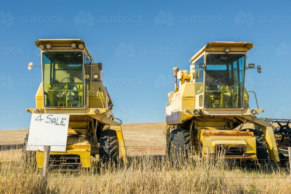 Secondhand farm machinery for sale on a rural property - Australian Stock Image