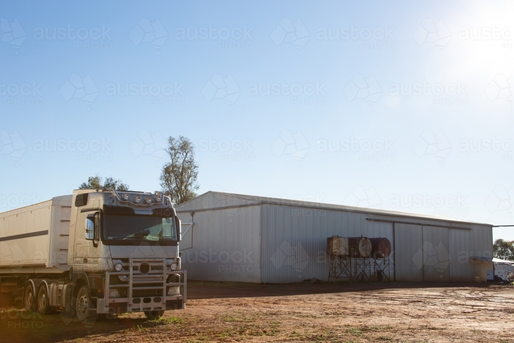 Semi trailer truck near shed on a farm - Australian Stock Image