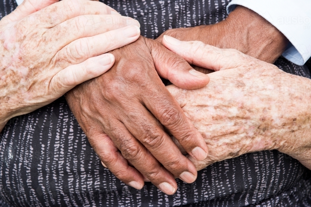 Senior couple holding hands. - Australian Stock Image