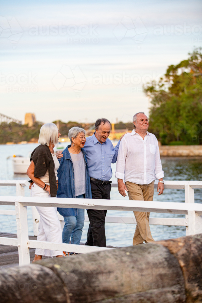 Senior couples walking on the pier at Sydney harbour - Australian Stock Image