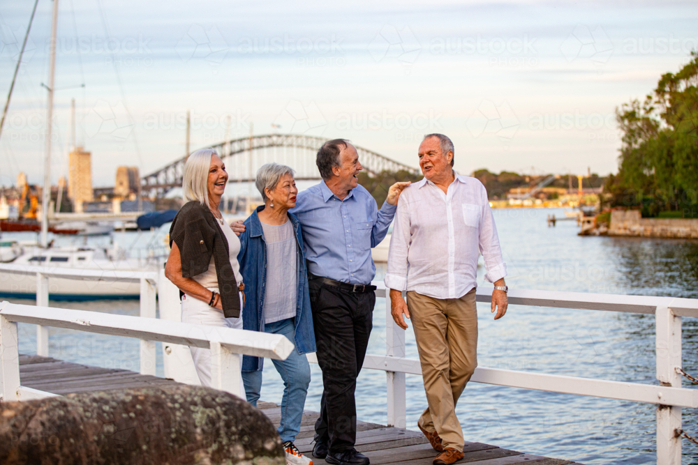 Senior couples walking on the pier at Sydney harbour - Australian Stock Image