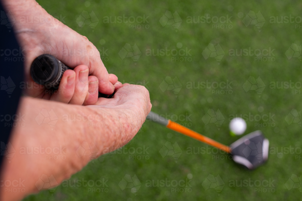 Senior Golfer Teeing Off - Australian Stock Image