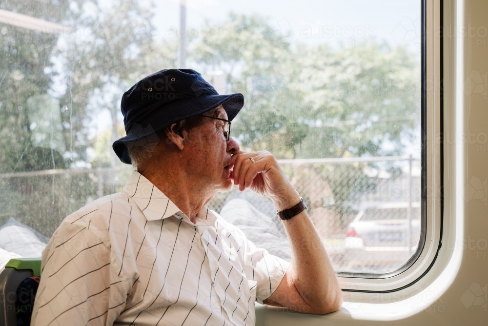 Senior man travelling on a public train Melbourne, Victoria - Australian Stock Image