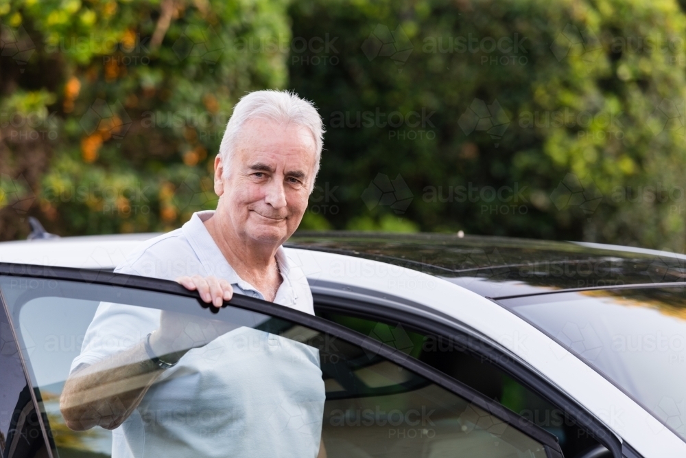 senior man with car - Australian Stock Image