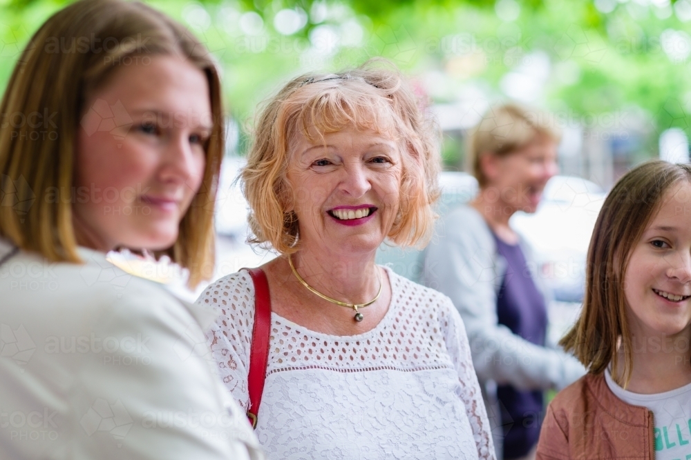senior woman out with her granddaughters - Australian Stock Image