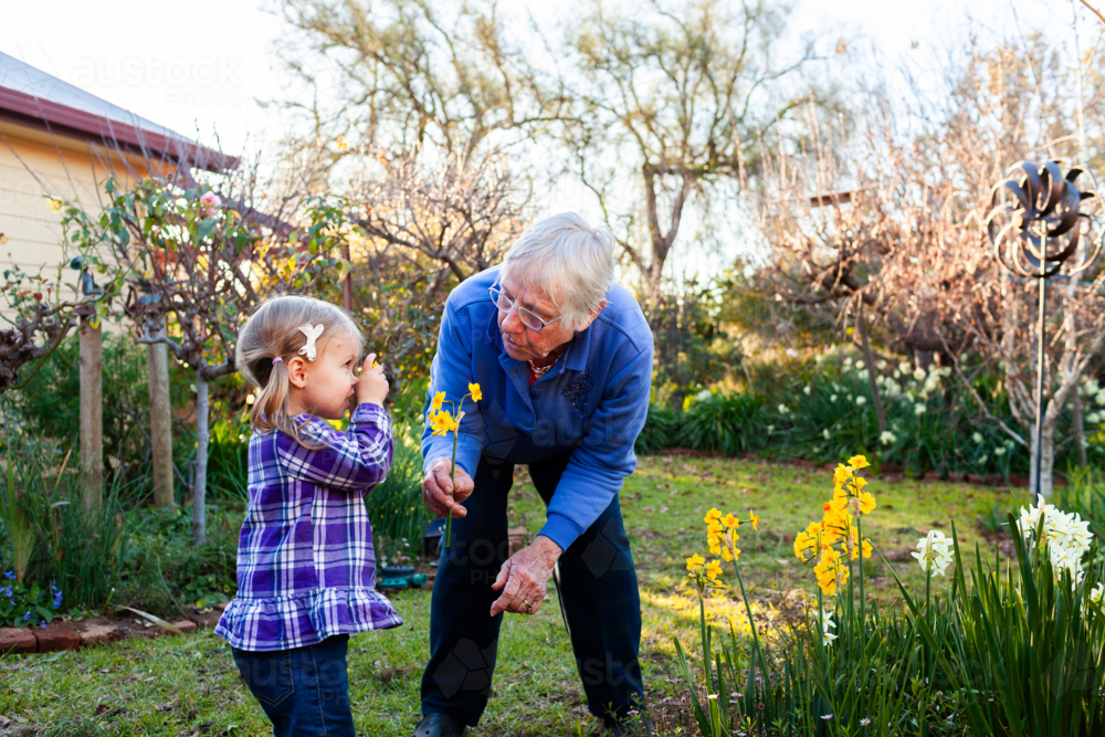 Senior woman with her granddaughter in the garden - Australian Stock Image
