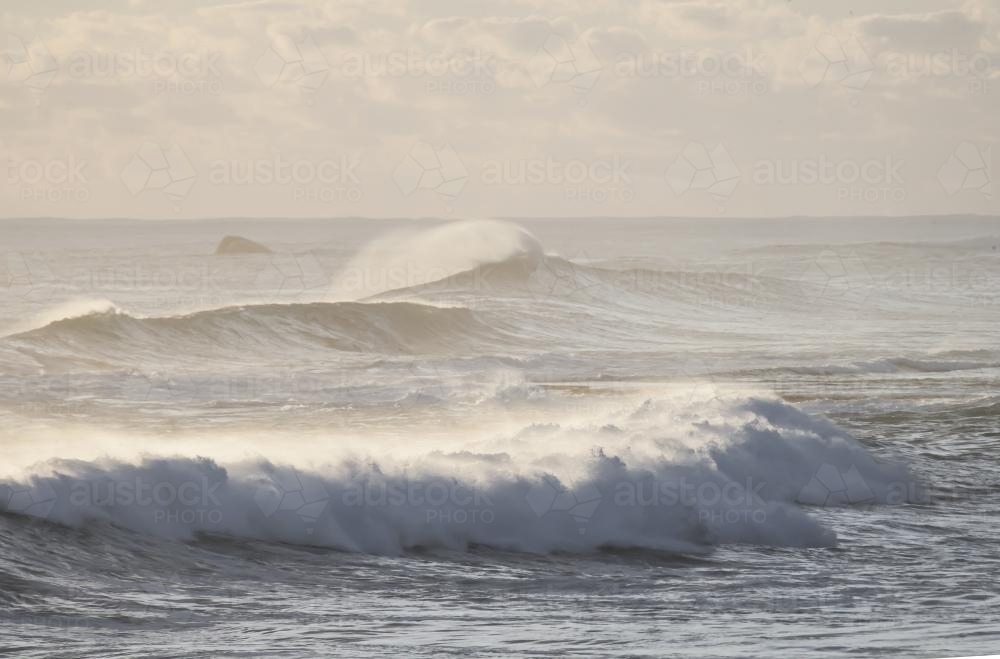 Set of waves rolling in a big swell - Australian Stock Image