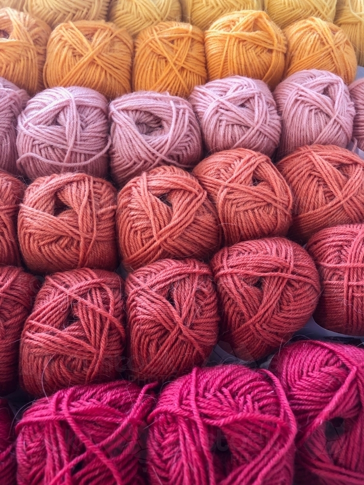 Sets of colourful skein yarn lined up in rows. - Australian Stock Image