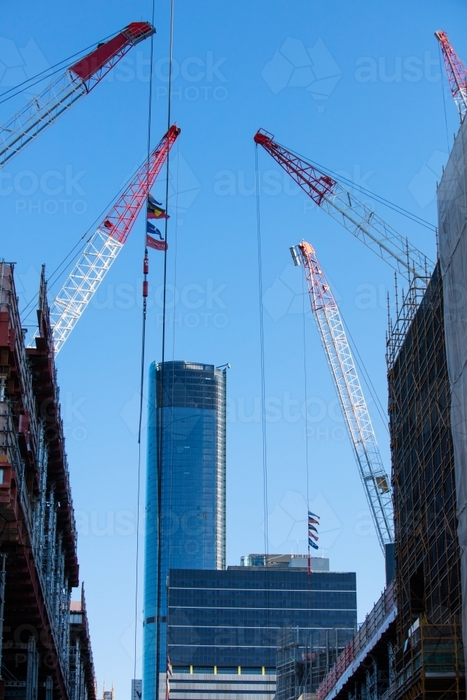 Several cranes operating in the Brisbane CBD and sky scrapers - Australian Stock Image