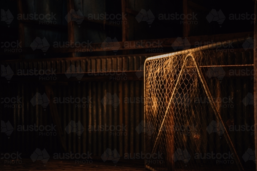 Shadow and light on a farm shed and gate - Australian Stock Image