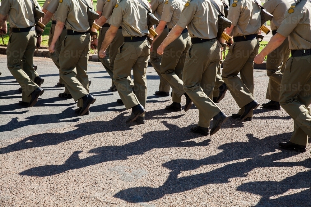 Shadows and legs of marching soldiers in the Australian Defense Force - Australian Stock Image