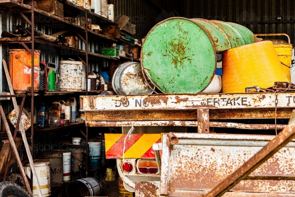 Shed with truck and old rusty tins and barrels - Australian Stock Image