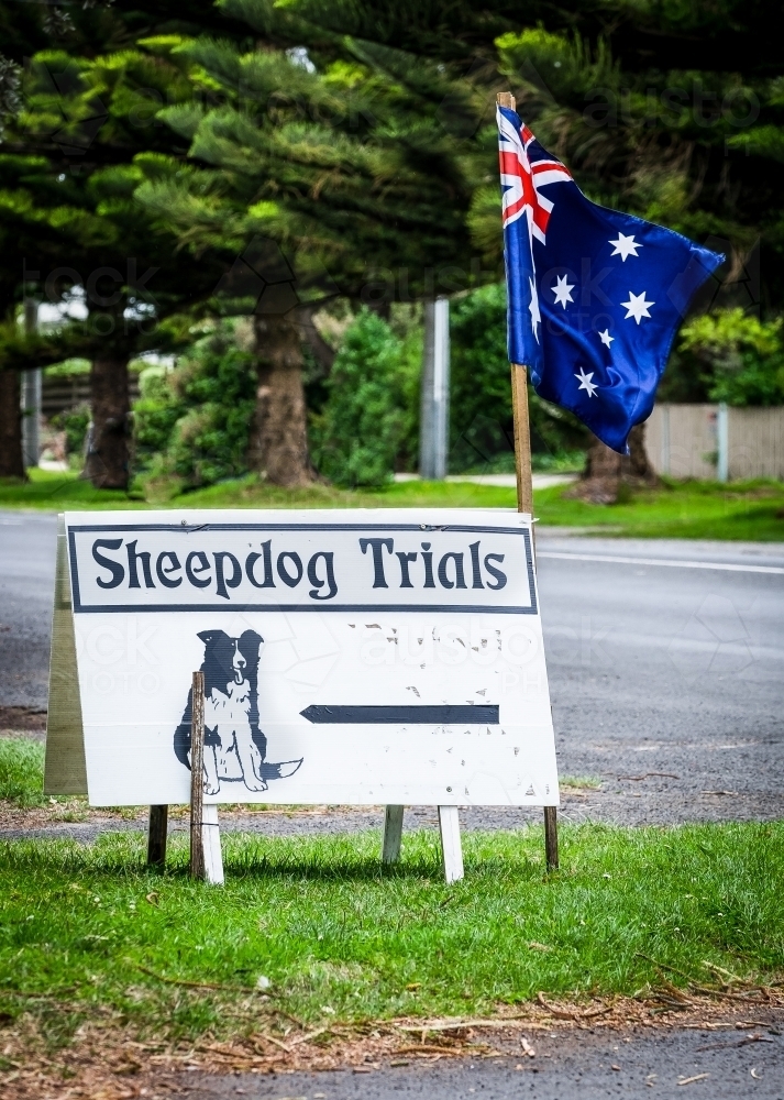 Sheep dog trials signage and Australian flag. - Australian Stock Image