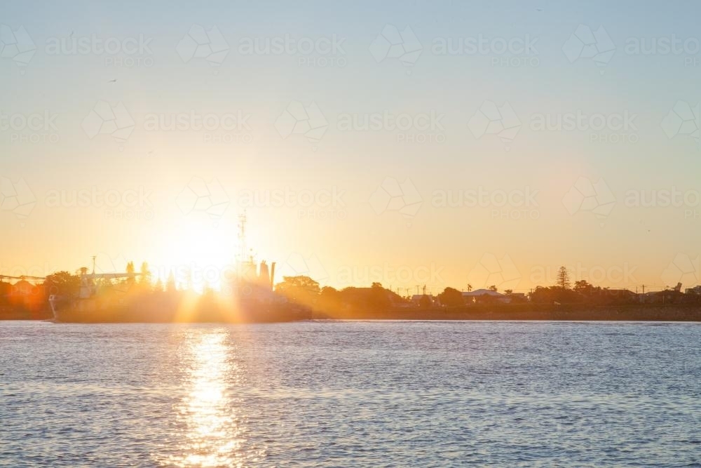 Ship coming into Newcastle Harbour at sunset - Australian Stock Image