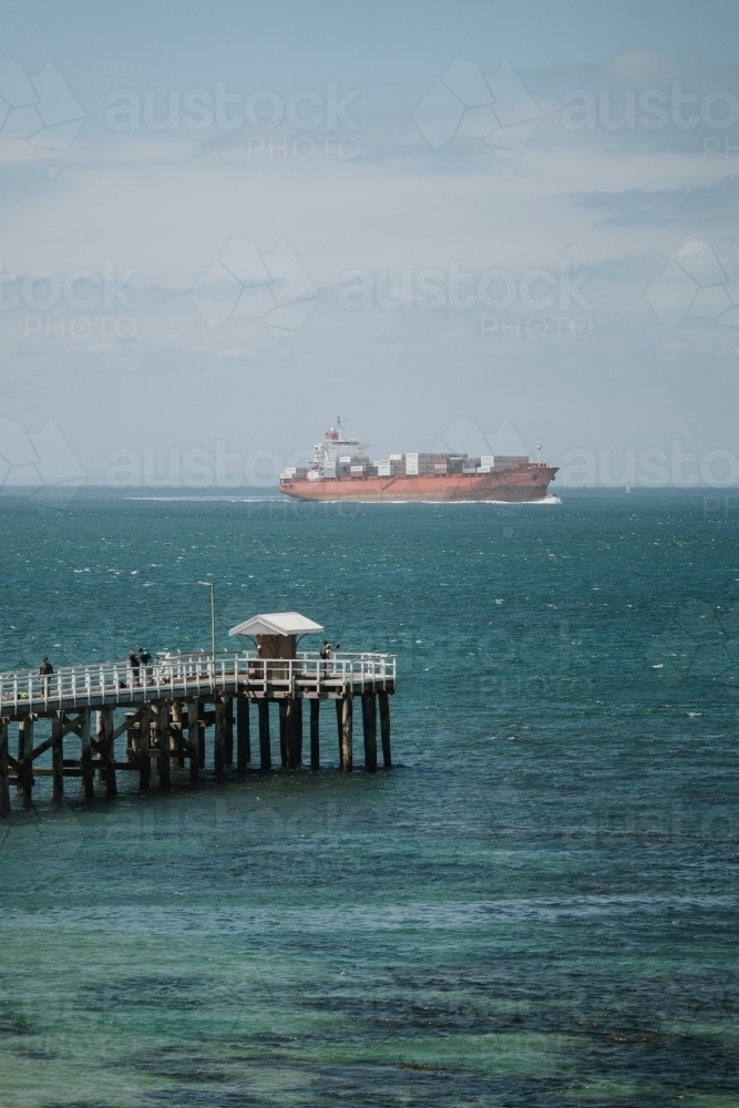 Ship passing pier - Australian Stock Image