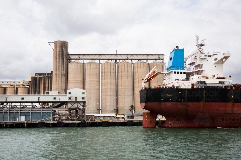 ships and silos in Gladstone harbour - Australian Stock Image