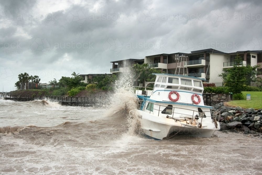 Shipwreck on rocks during Cyclone Yasi - Australian Stock Image