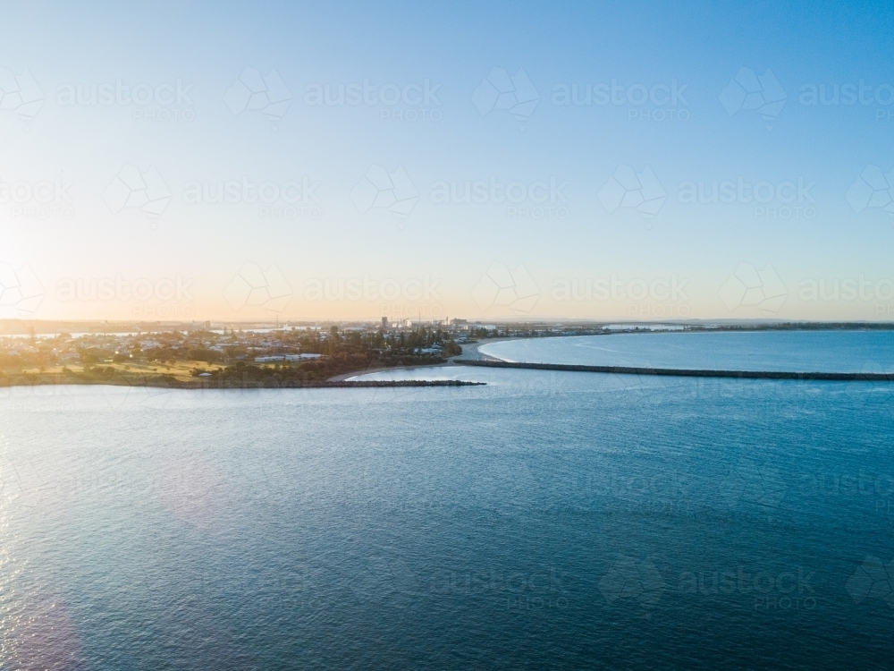Shipwreck Walk breakwater Stockton seen over water from Nobbys - Australian Stock Image