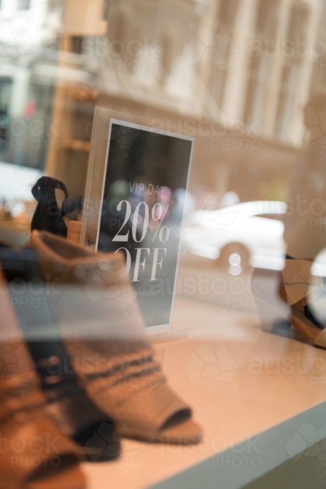Shoe sale through shop window - Australian Stock Image