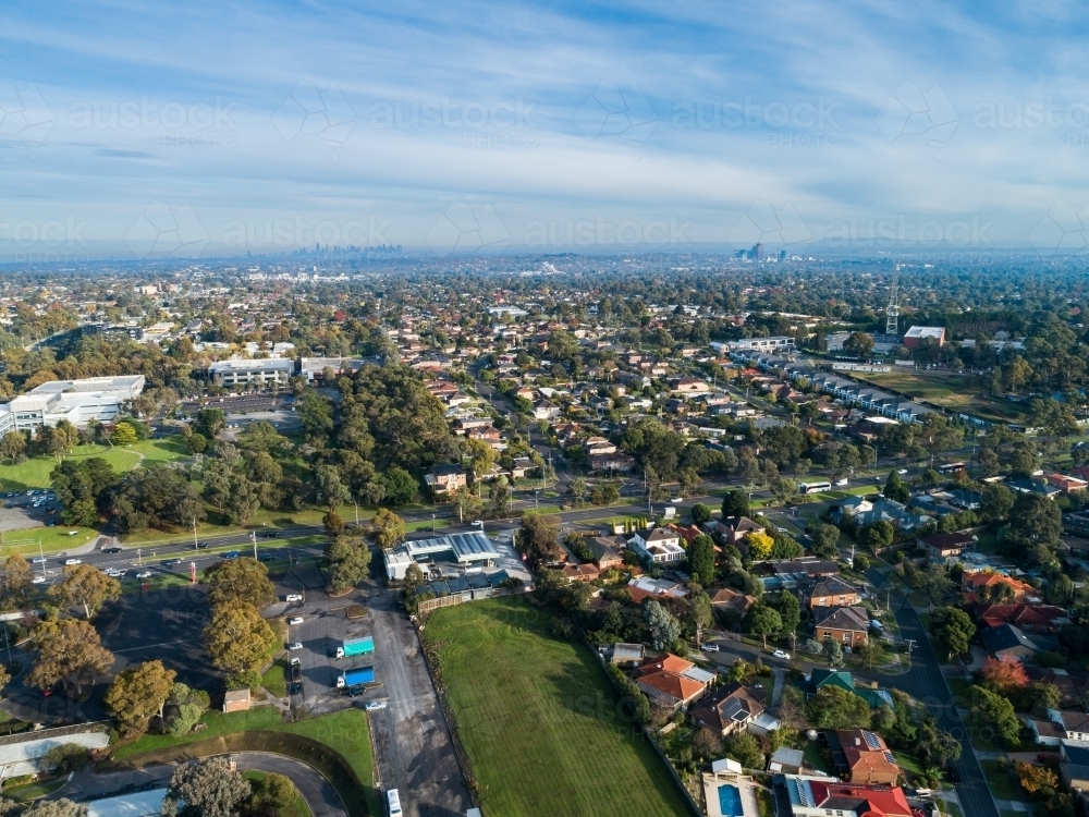 Shopping centre and green space with Melbourne city on horizon - Australian Stock Image