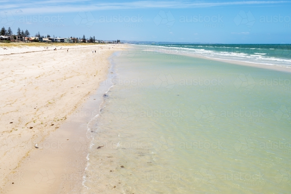 shoreline on shallow water near sand bar at city beach - Australian Stock Image