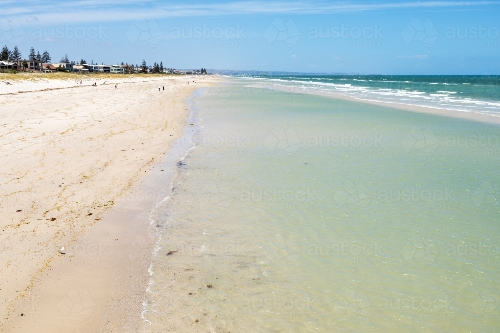 shoreline on shallow water near sand bar at city beach - Australian Stock Image