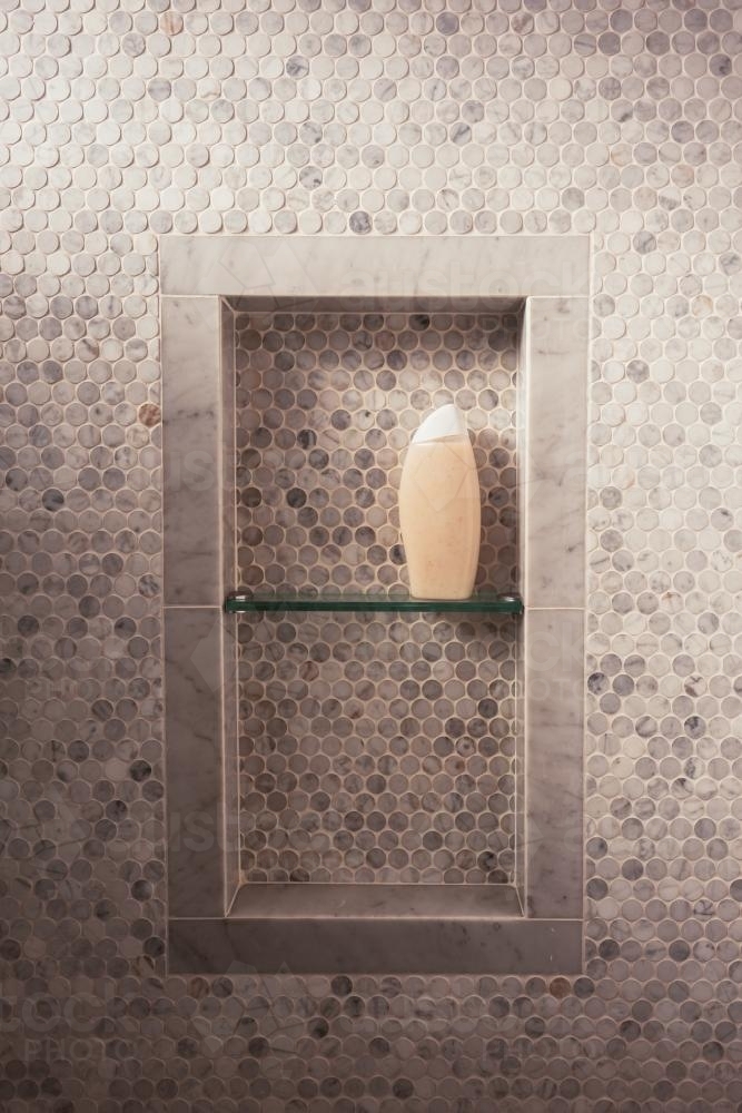 shower recess with single bottle of soap or shampoo - Australian Stock Image