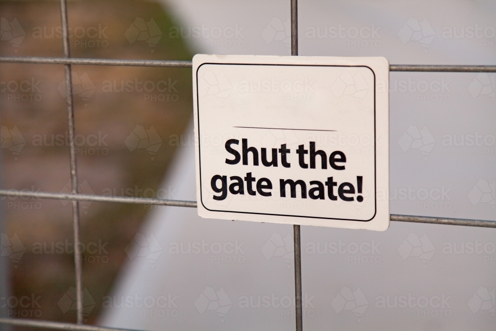 Image of shut the gate mate sign on Aussie gate Austockphoto