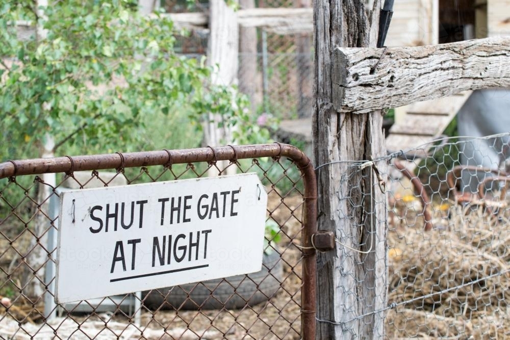 Shut the gate sign on a chicken coop. - Australian Stock Image