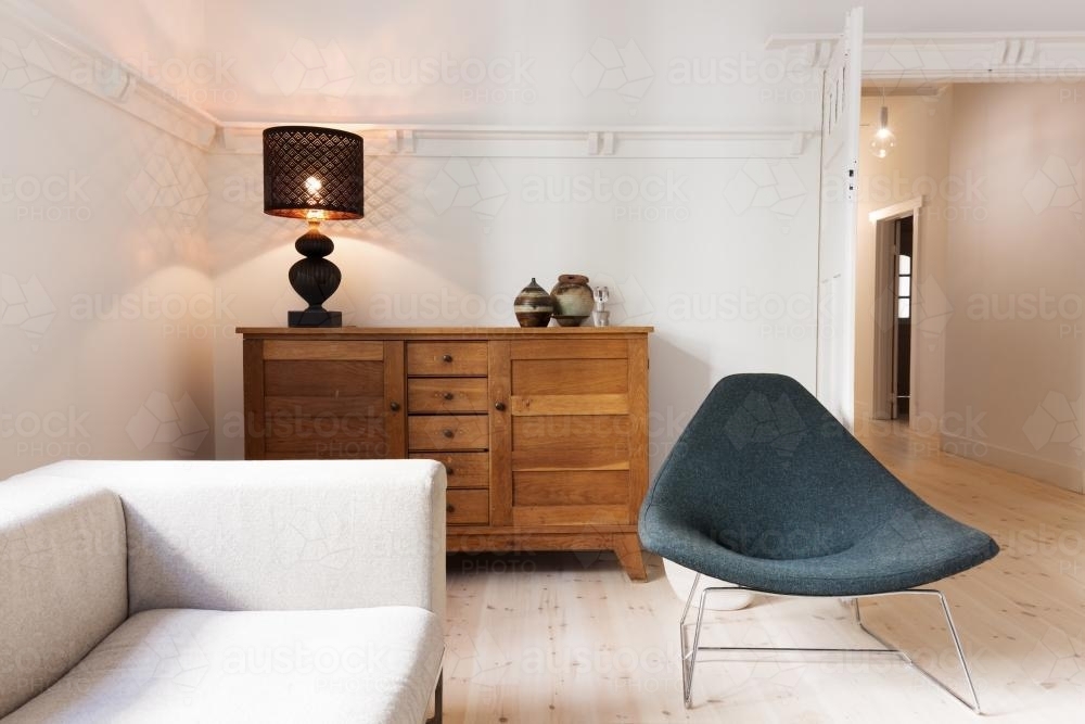 Side board buffet chair and lamp in a luxury apartment renovation - Australian Stock Image