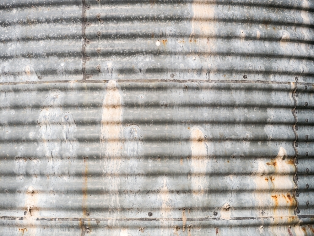 Side of an old, leaky corrugated iron water tank - Australian Stock Image