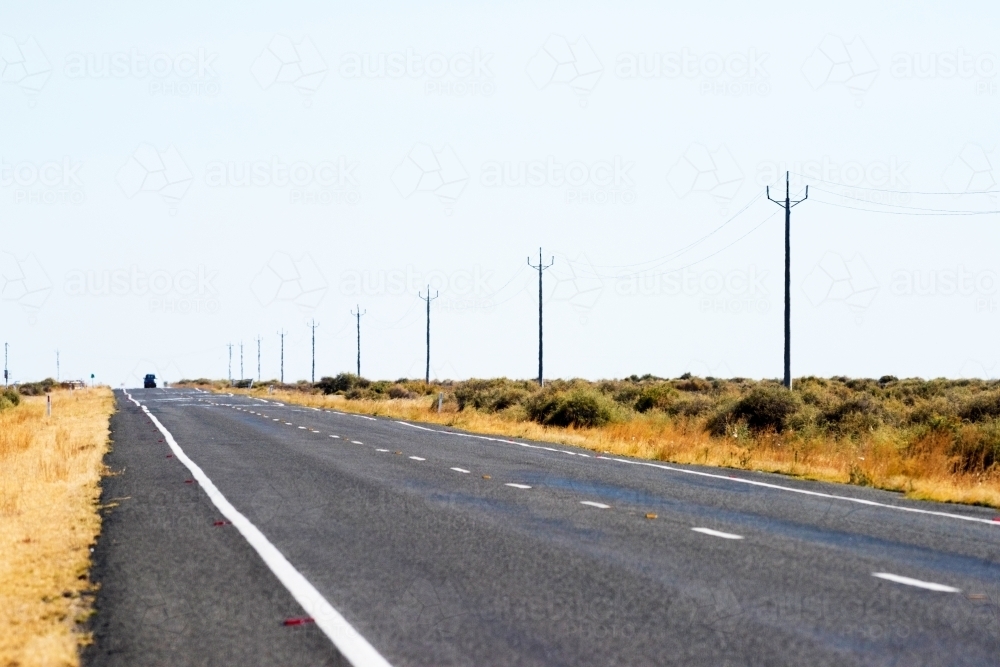 Side of road in a dry, barren land. - Australian Stock Image
